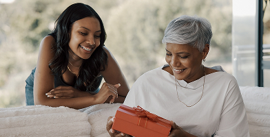 Grandmother with a gift and her grandchild